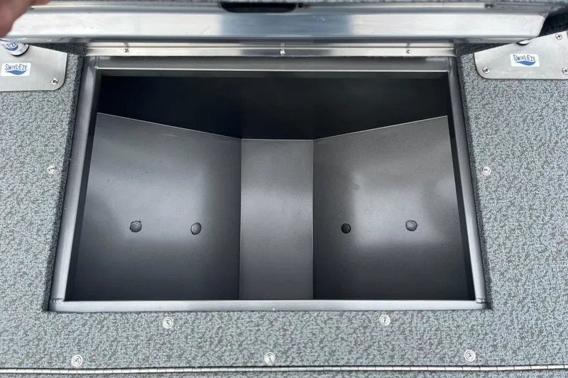 Slide: The Image of Open storage compartment on 2025 Lowe Deck SD224 boat. - 14