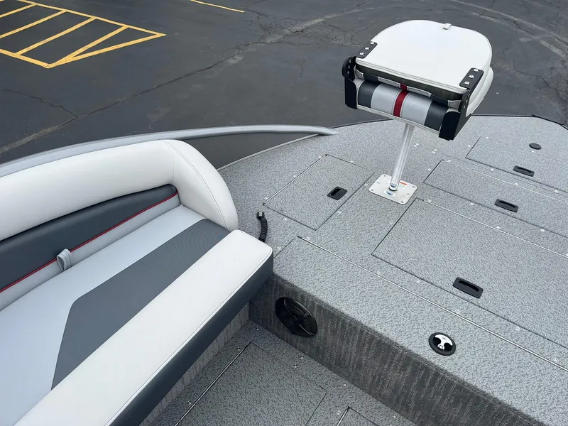 Slide: The Image of 2025 Lowe Deck SD224 boat interior with seating and storage compartments. - 17