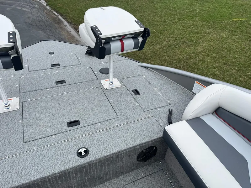 Slide: The Image of 2025 Lowe Deck SD224 boat interior with seating and storage compartments. - 18