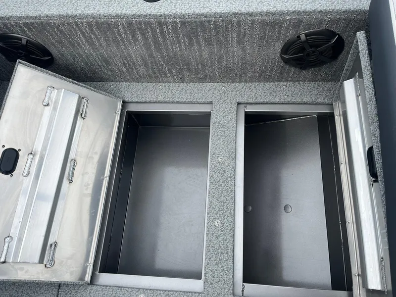 Slide: The Image of 2025 Lowe Deck SD224 storage compartments with open lids, showcasing spacious interior design. - 31