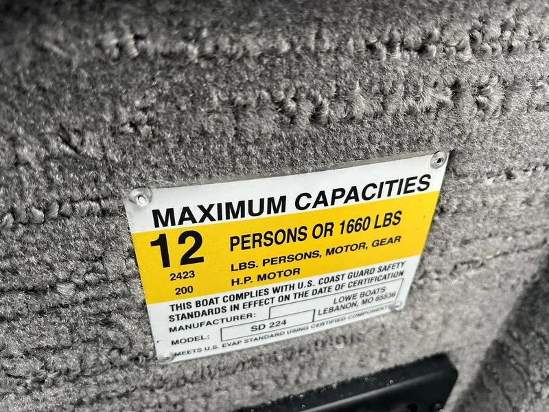 Slide: The Image of Maximum capacity label on 2025 Lowe Deck SD224 boat, 12 persons or 1660 lbs. - 37