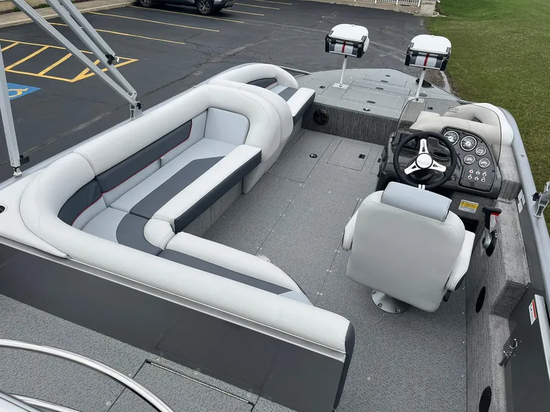 Slide: The Image of 2025 Lowe Deck SD224 boat interior with seating and steering console. - 8