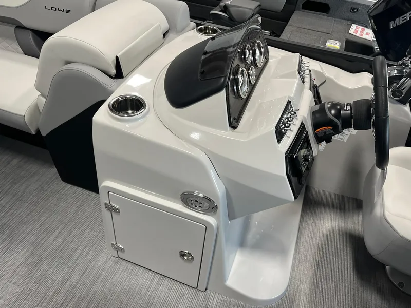 Slide: The Image of 2025 Lowe SS 230 WV boat console with steering wheel and gauges. - 14