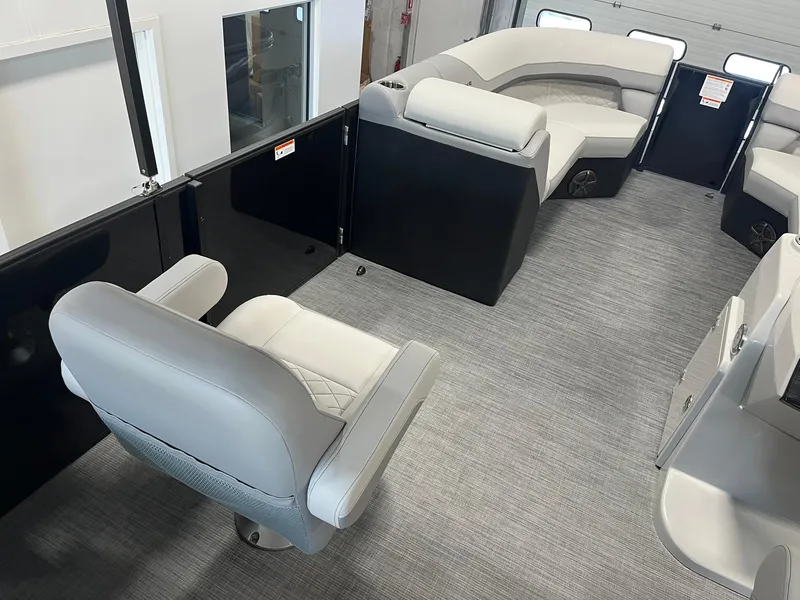 Slide: The Image of Interior of 2025 Lowe SS 230 WV pontoon boat with gray seating and carpet. - 15