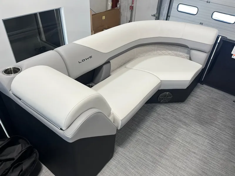 Slide: The Image of 2025 Lowe SS 230 WV boat interior with plush seating and modern design. - 18