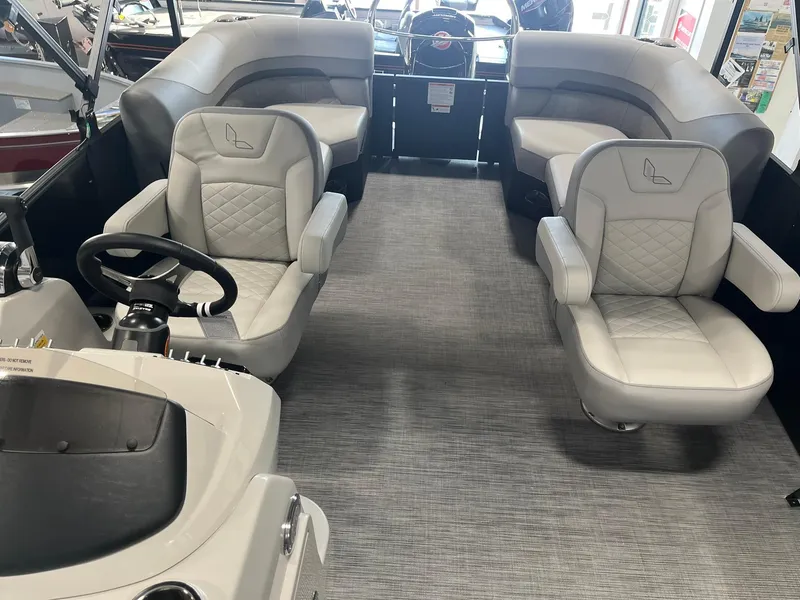 Slide: The Image of 2025 Lowe SS 230 WV boat interior with plush seating and modern design. - 9