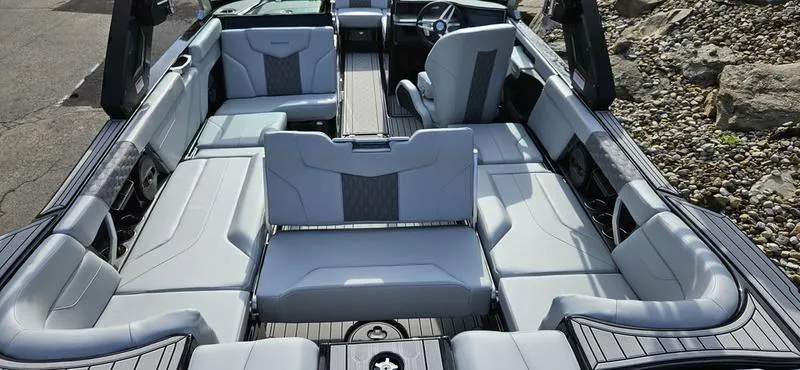 Slide: The Image of 2025 MasterCraft XT24 boat interior with luxurious seating and modern design. - 14