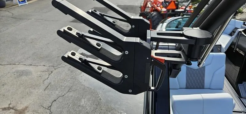 Slide: The Image of 2025 MasterCraft XT24 boat with advanced wakeboard rack system. - 16