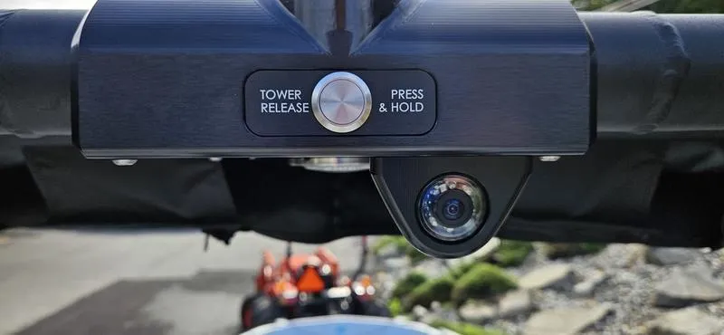 Slide: The Image of 2025 MasterCraft XT24 tower release button and camera close-up. - 18