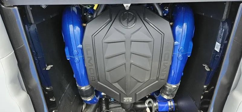 Slide: The Image of 2025 MasterCraft XT24 engine with blue components and black cover. - 19
