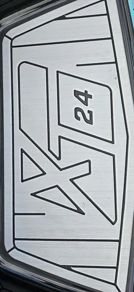 Slide: The Image of 2025 MasterCraft XT24 logo on metallic surface. - 21