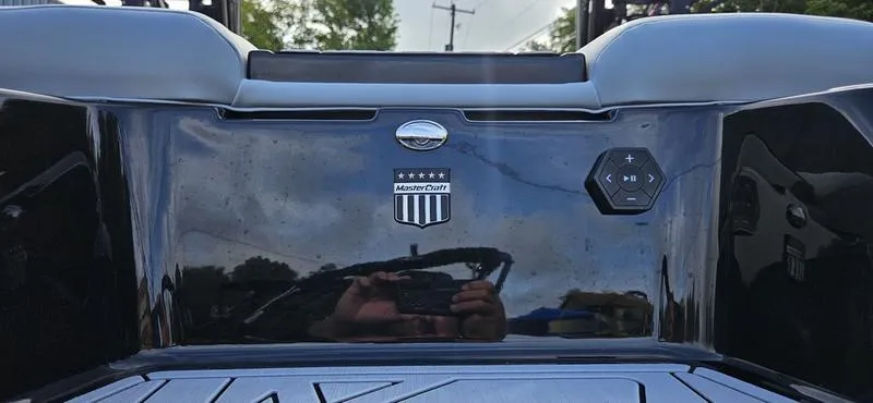 Slide: The Image of 2025 MasterCraft XT24 boat dashboard with logo and control panel. - 22