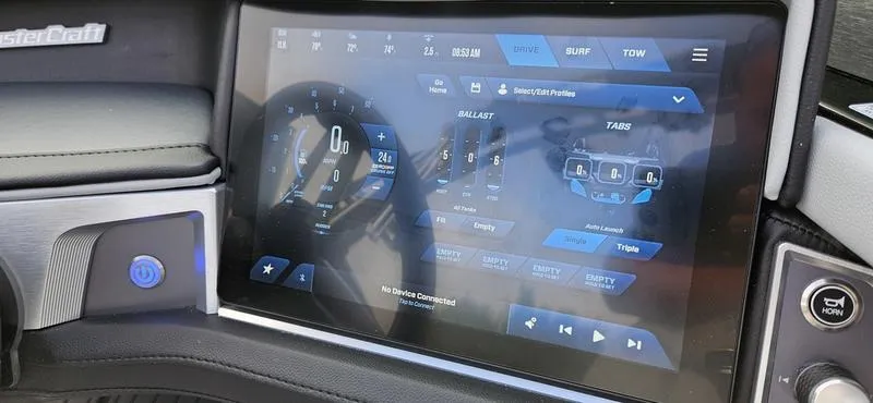Slide: The Image of 2025 MasterCraft XT24 dashboard touchscreen displaying controls and settings. - 8