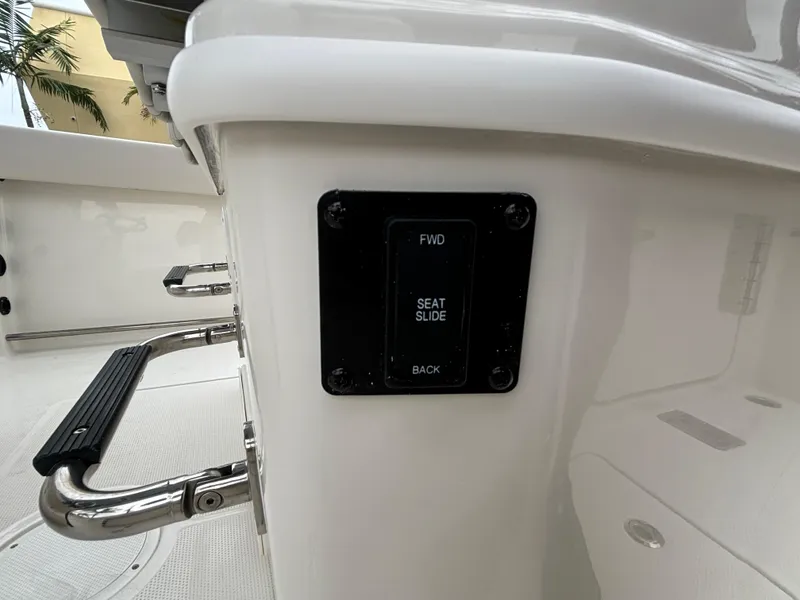 Slide: The Image of 2025 Sailfish 272 CC boat seat slide control panel. - 14