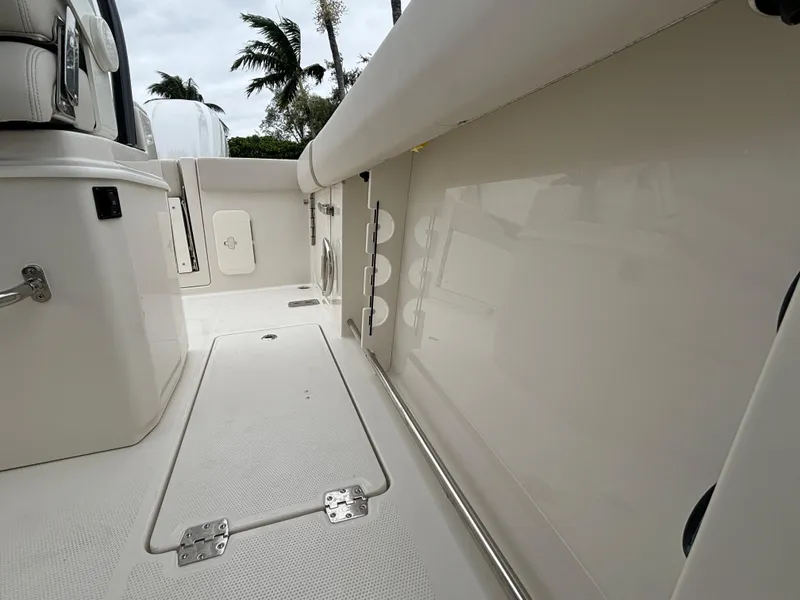 Slide: The Image of 2025 Sailfish 272 CC boat interior with storage compartments and sleek design. - 16