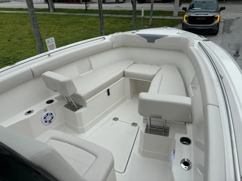 Slide: The Image of 2025 Sailfish 272 CC boat interior with white seating and modern design. - 23