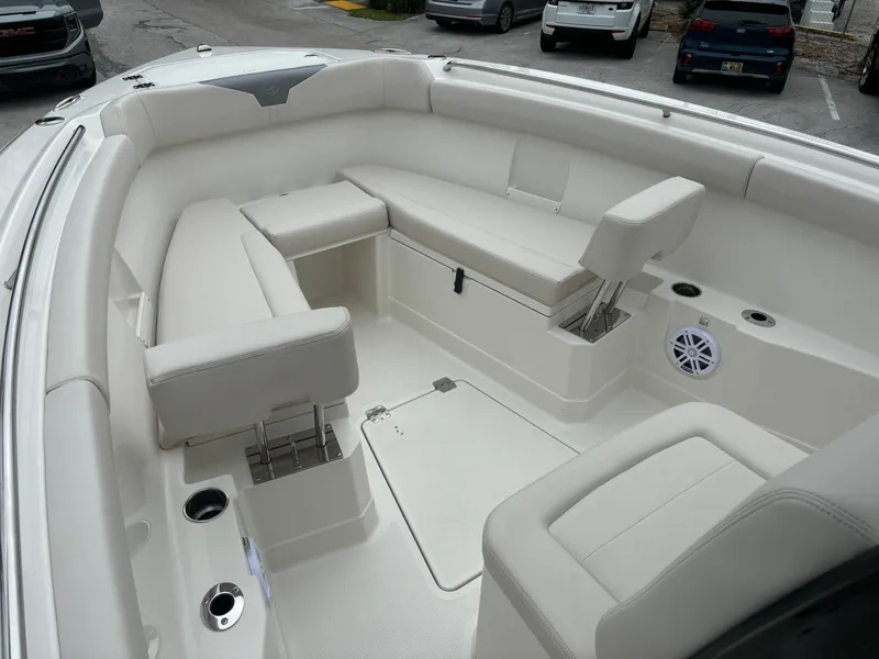 Slide: The Image of 2025 Sailfish 272 CC boat interior with white seating and storage compartments. - 24