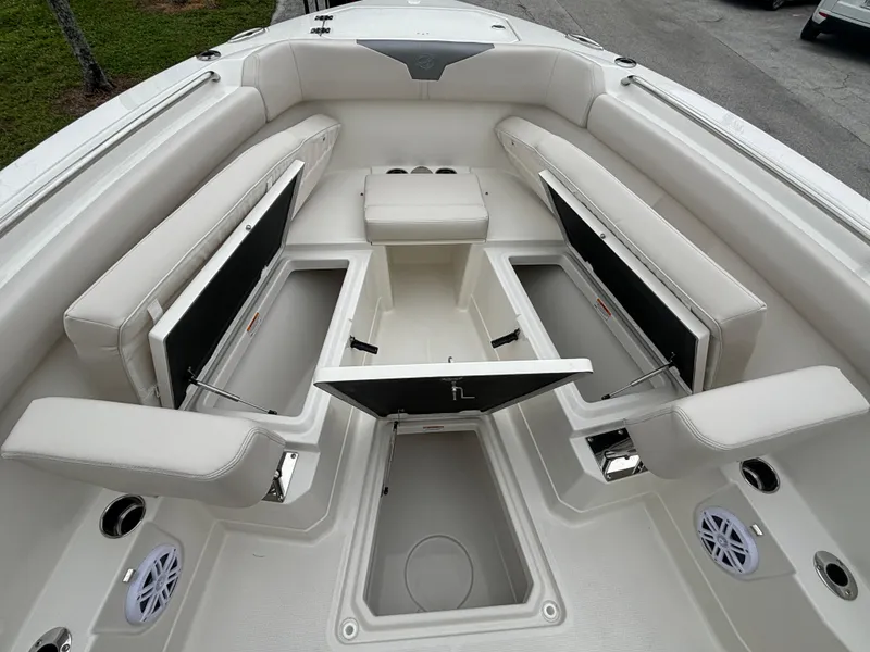 Slide: The Image of 2025 Sailfish 272 CC boat interior with open storage compartments and seating. - 26