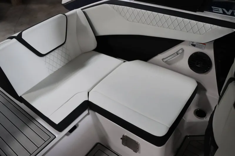 Slide: The Image of 2025 Yamaha Boats 222SD interior seating with white upholstery and black accents. - 13