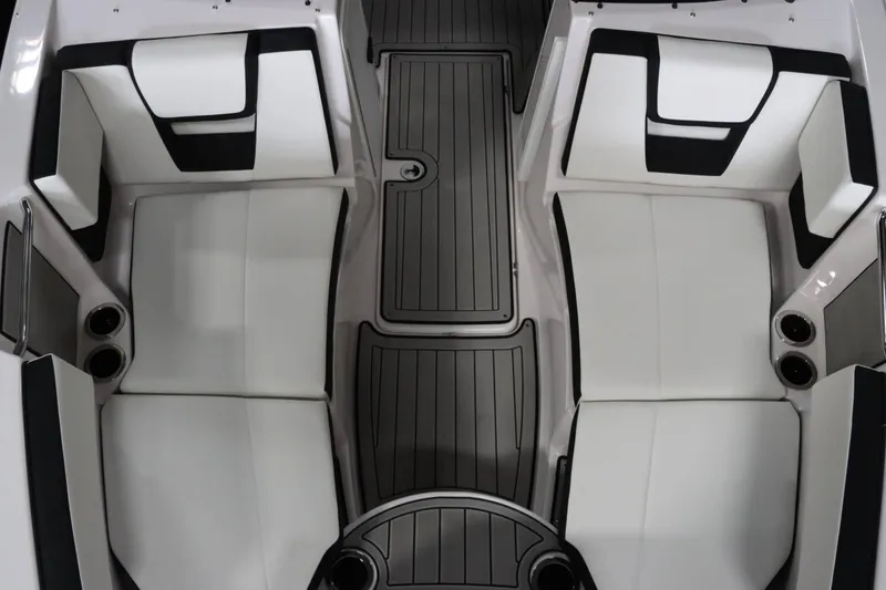 Slide: The Image of 2025 Yamaha Boats 222SD interior seating with sleek, modern design and cup holders. - 21