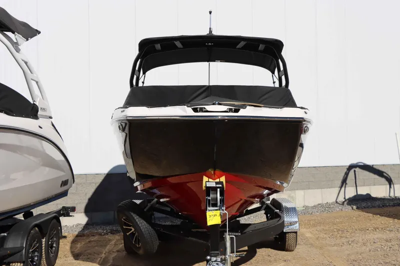 Slide: The Image of 2025 Yamaha Boats 222SD on trailer, front view, black and red hull. - 4