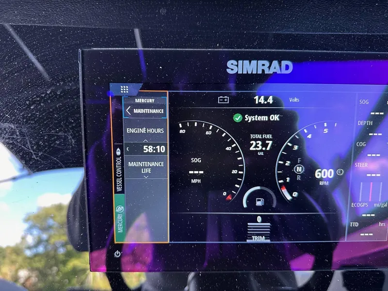 Slide: The Image of Simrad display on 2022 Sea Ray 230SPX showing engine hours and system status. - 13