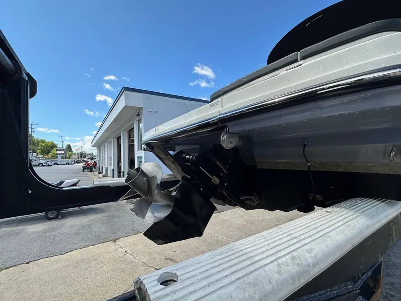 Slide: The Image of 2022 Sea Ray 230SPX boat propeller and stern view at a dealership. - 5