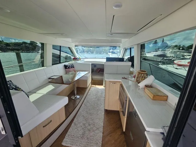 Slide: The Image of Luxurious interior of 2024 Regal 42 Fly yacht with modern seating and panoramic windows. - 3