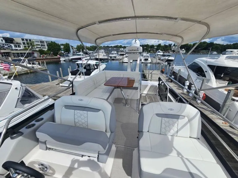 Slide: The Image of 2024 Regal 42 Fly yacht interior with seating and table at marina. - 5