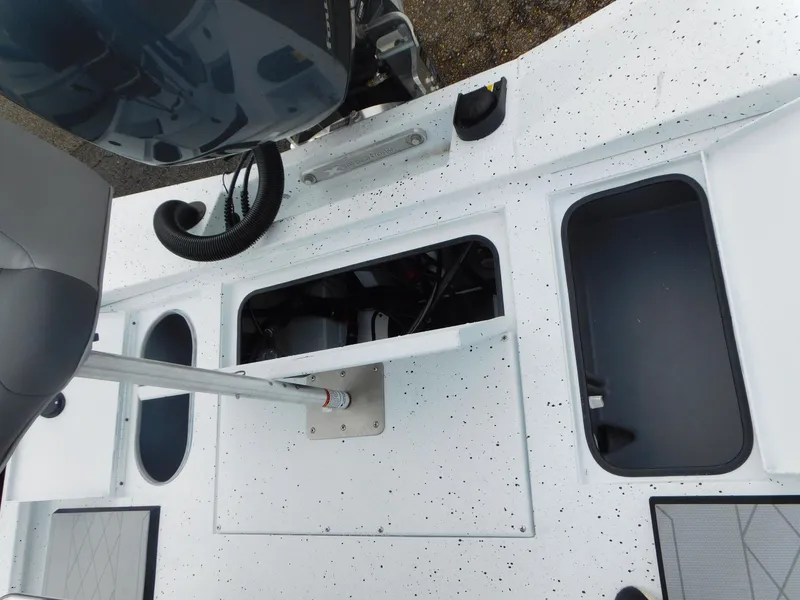 Slide: The Image of 2025 Xpress H21 Bay boat deck with open storage compartments. - 10