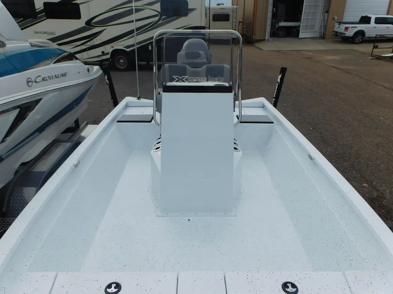 Slide: The Image of 2025 Xpress H21 Bay boat with center console in a marina setting. - 5