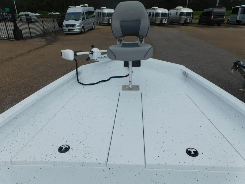Slide: The Image of 2025 Xpress H21 Bay boat with a front seat and trolling motor. - 7