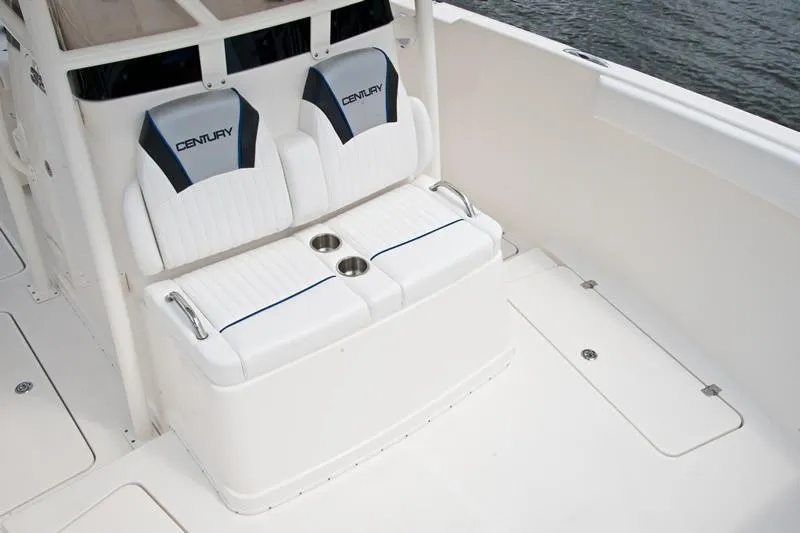 Slide: The Image of Century 3200 Center Console 2015 boat seating area with cup holders. - 15