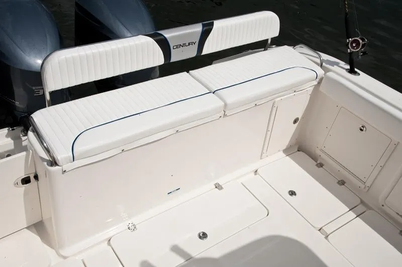Slide: The Image of Century 3200 Center Console 2015 boat seating area with dual engines. - 17