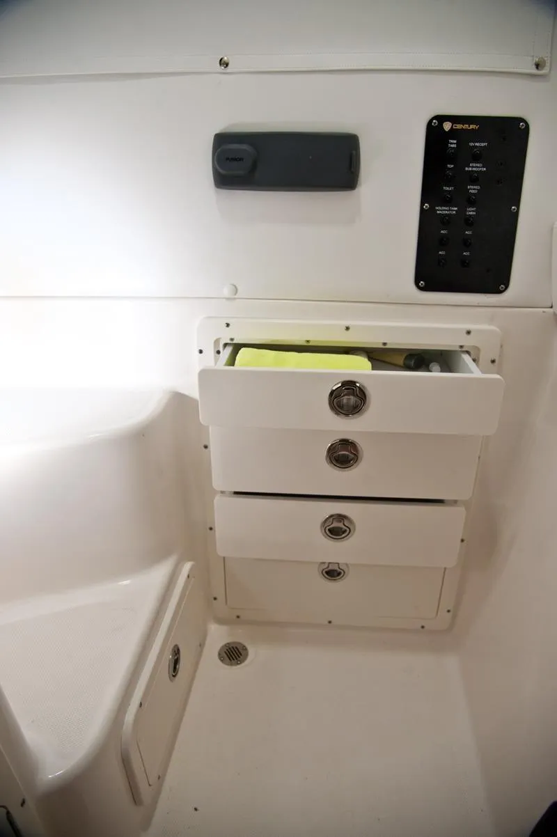 Slide: The Image of 2015 Century 3200 Center Console interior with storage drawers and control panel. - 19