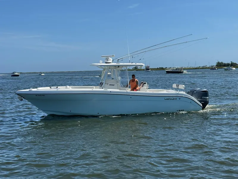 Slide: The Image of 2015 Century 3200 Center Console boat cruising on a sunny day. - 20