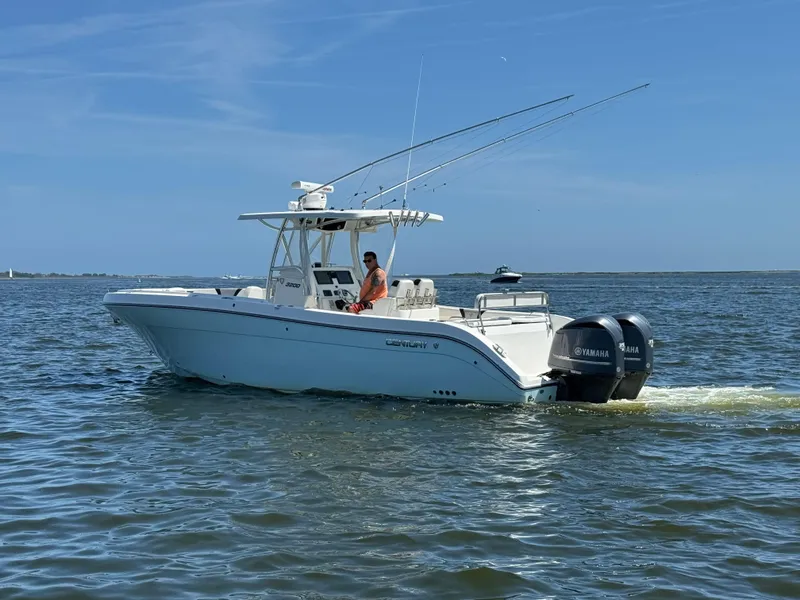 Slide: The Image of 2015 Century 3200 Center Console boat cruising on open water. - 21