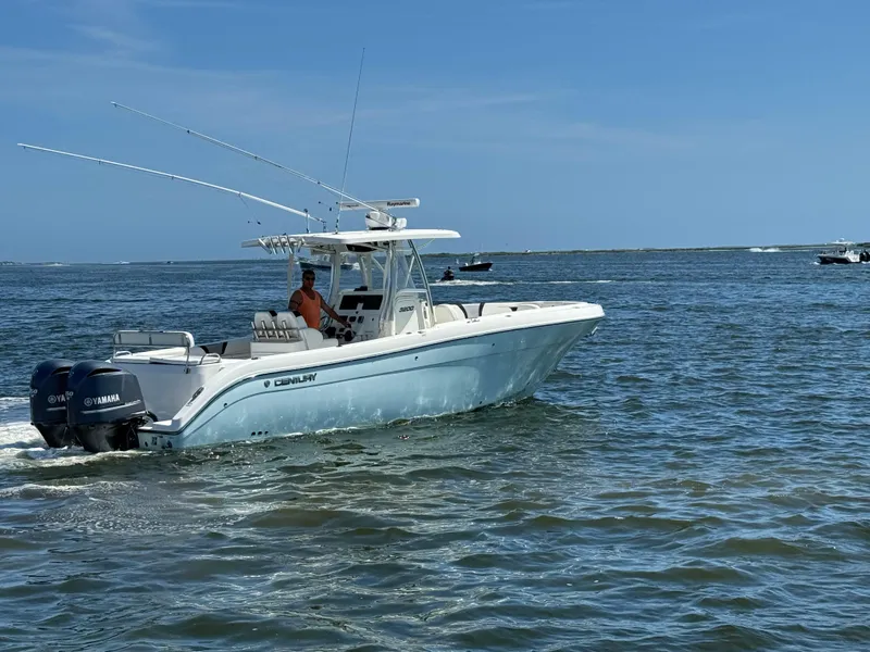 Slide: The Image of 2015 Century 3200 Center Console boat cruising on open water. - 24