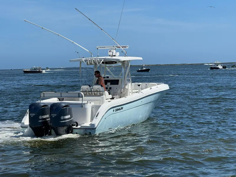 Slide: The Image of 2015 Century 3200 Center Console boat cruising on open water. - 25