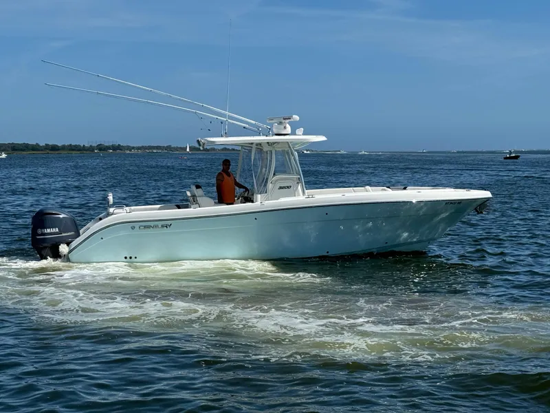 Slide: The Image of 2015 Century 3200 Center Console boat cruising on open water. - 26