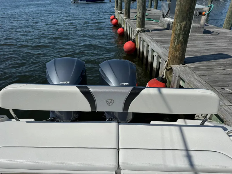 Slide: The Image of 2015 Century 3200 Center Console boat docked with twin engines. - 30