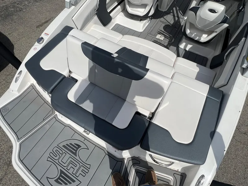 Slide: The Image of 2021 Chaparral 21 Surf boat interior with stylish seating and deck design. - 10