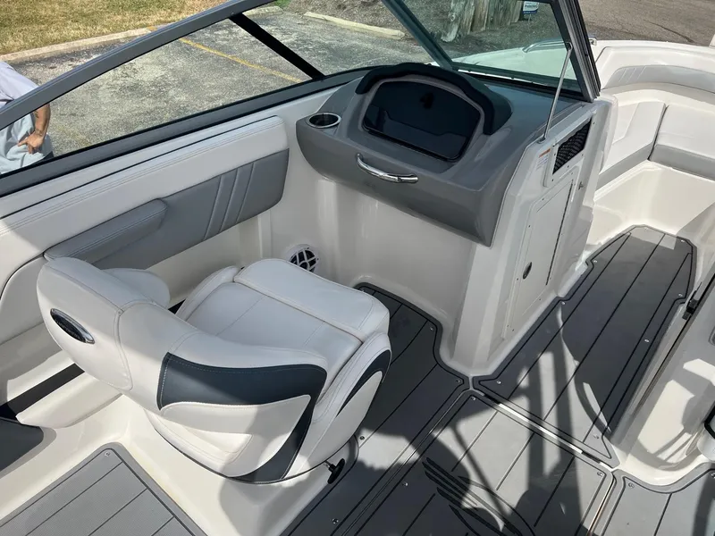 Slide: The Image of 2021 Chaparral 21 Surf boat interior with sleek seating and modern dashboard design. - 8