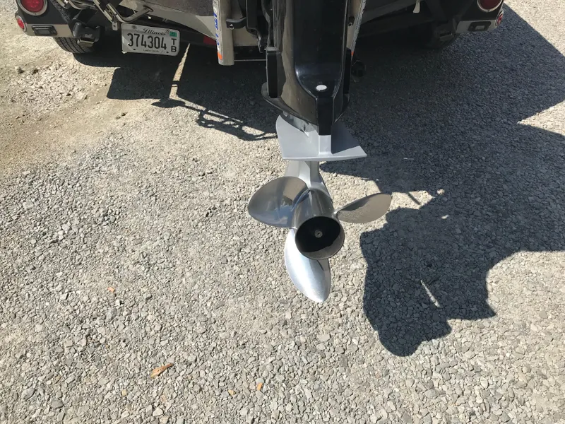 Slide: The Image of 2017 Ranger Z520 Comanche boat propeller on gravel surface. - 13