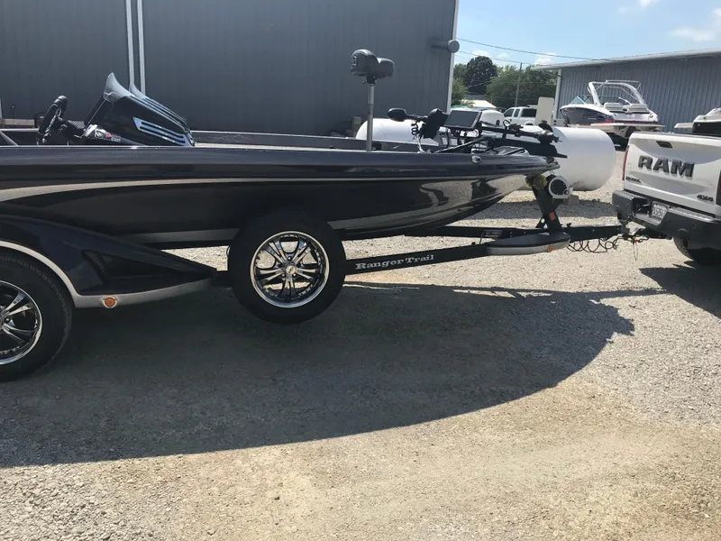 Slide: The Image of 2017 Ranger Z520 Comanche boat on trailer, parked outdoors. - 22
