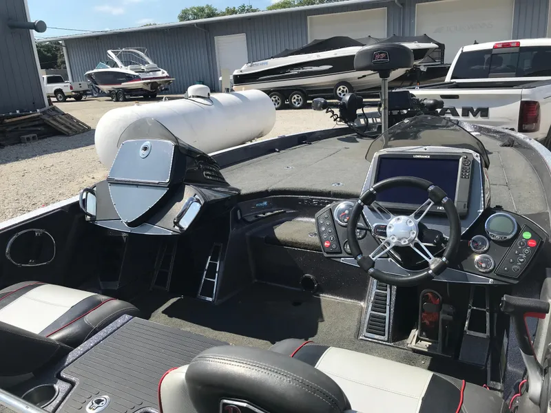 Slide: The Image of 2017 Ranger Z520 Comanche boat interior with steering wheel and control panel. - 28