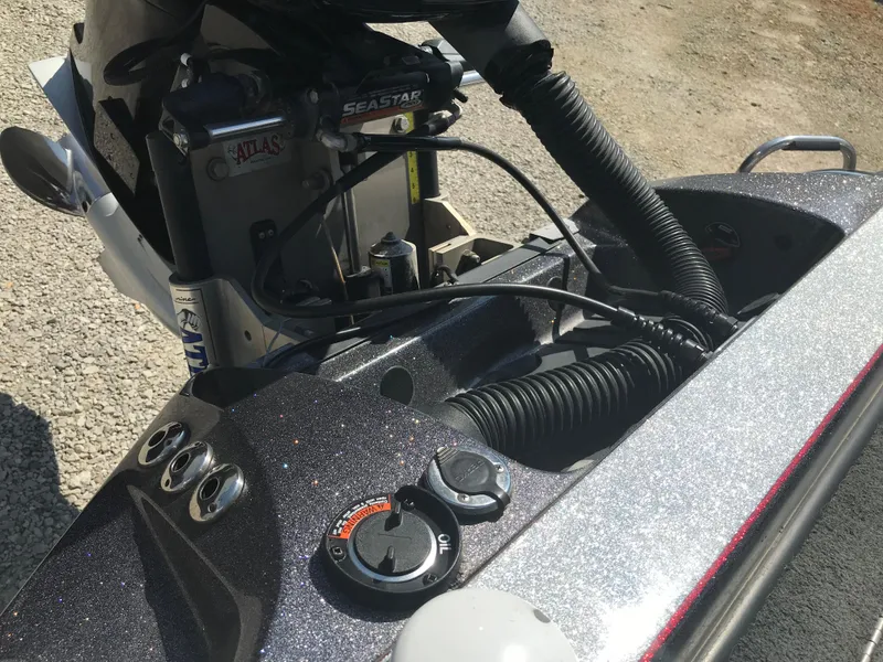 Slide: The Image of Close-up of 2017 Ranger Z520 Comanche boat controls and engine components. - 29