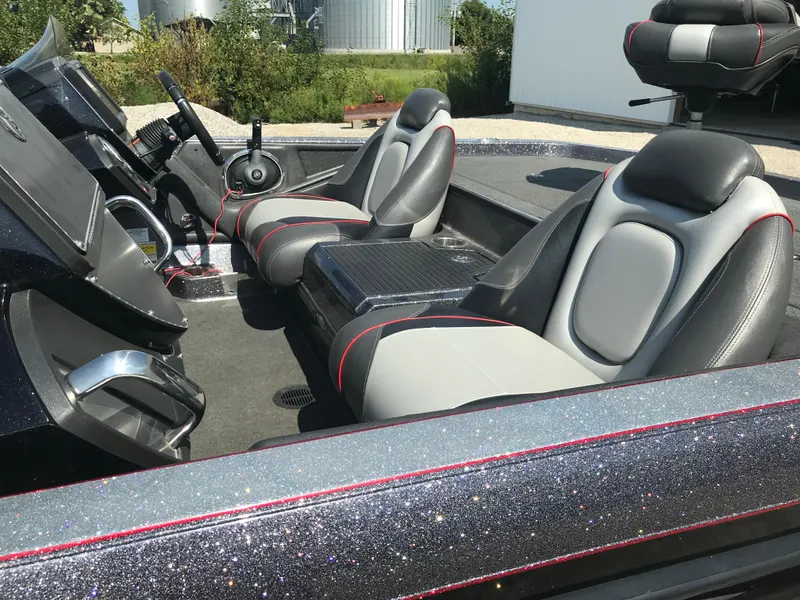 Slide: The Image of 2017 Ranger Z520 Comanche boat interior with sleek seating and modern dashboard. - 3