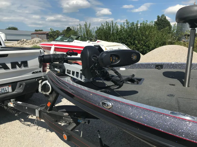 Slide: The Image of 2017 Ranger Z520 Comanche boat on trailer, parked near a white truck. - 6