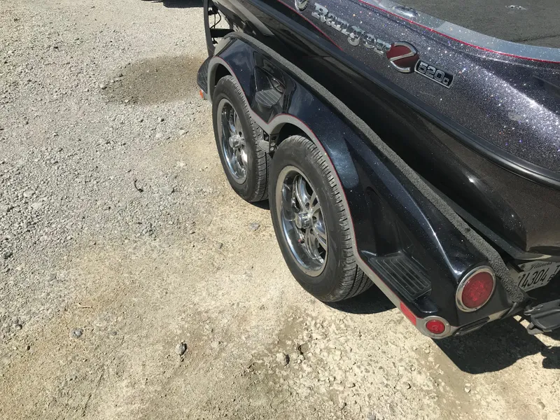 Slide: The Image of 2017 Ranger Z520 Comanche boat trailer on gravel surface. - 8